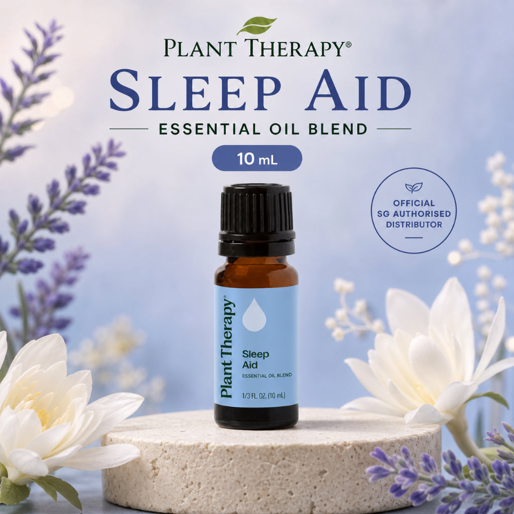 Plant Therapy Sleep Aid Essential Oil Blend 10ml bottle surrounded by white flowers and lavender